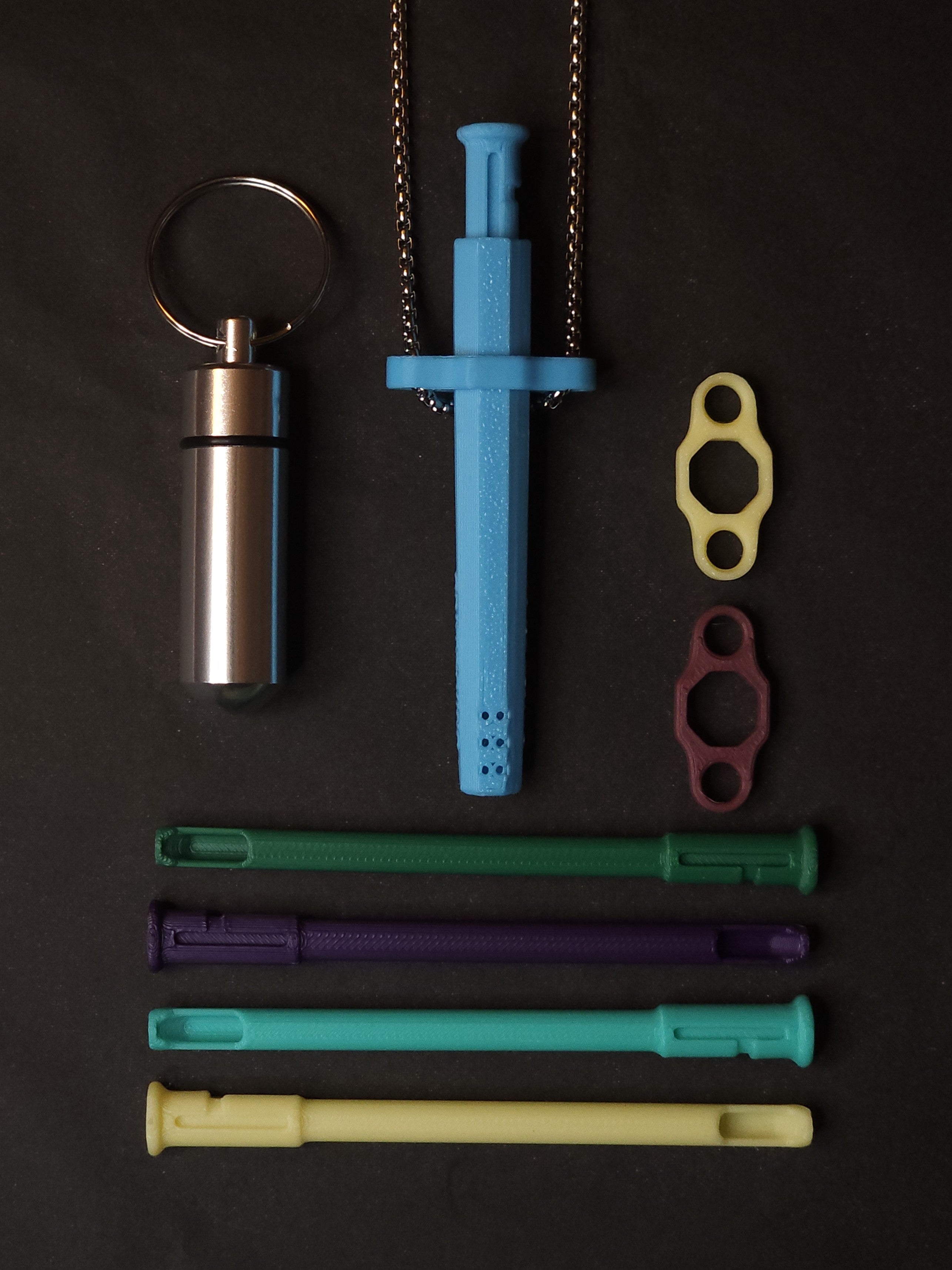 Starter Pack contents: Sniff & Slide Color Remix pendant on box chain, stash container, 4 inserts and 2 adapters laid out together