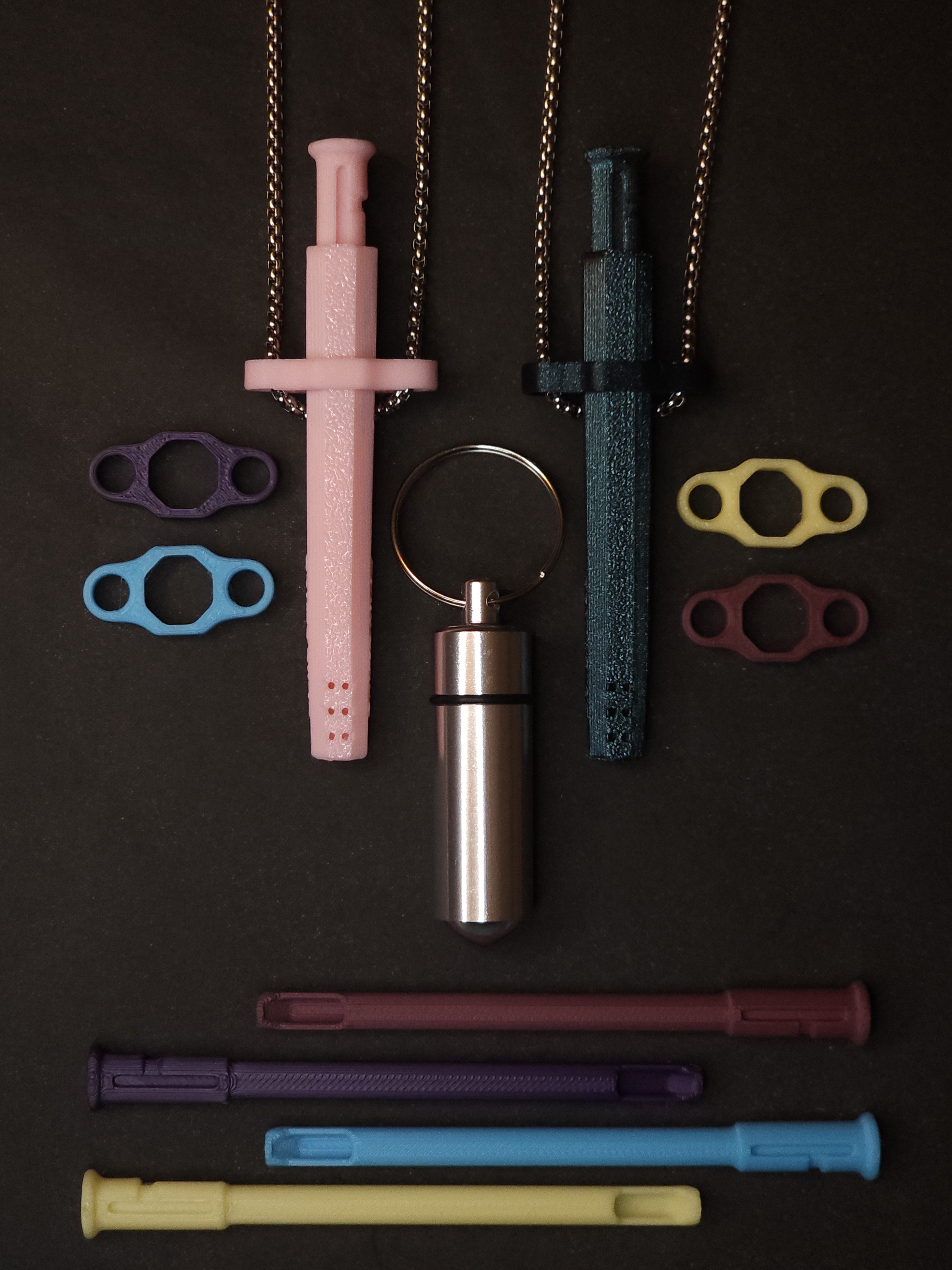 His & Hers bundle contents: two Sniff & Slide Color Remix pendants on box chains, stash container, 4 inserts and 4 adapters