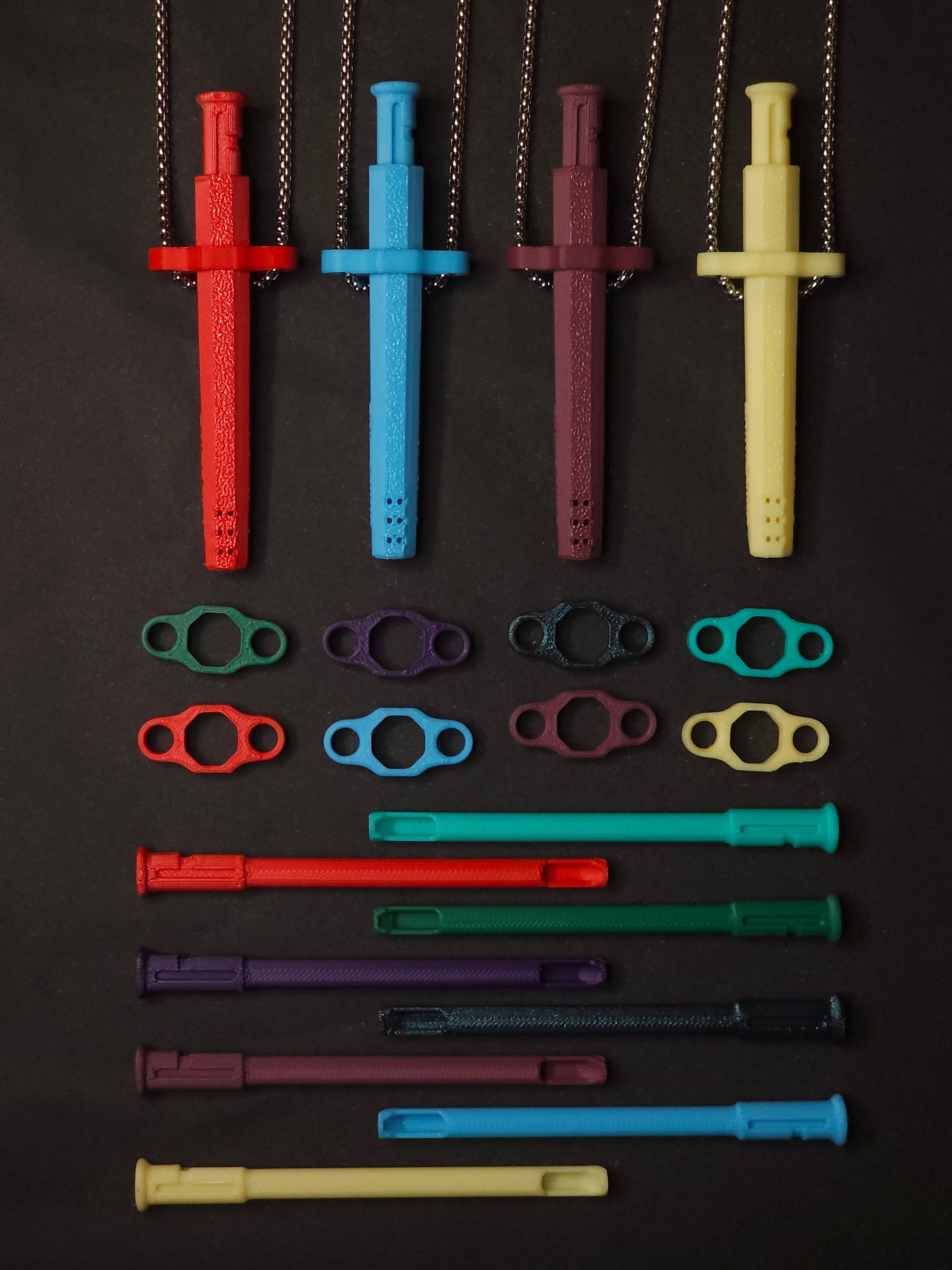Squad Pack contents: four Sniff & Slide Color Remix pendants on box chains with 8 inserts and 8 adapters, grouped together