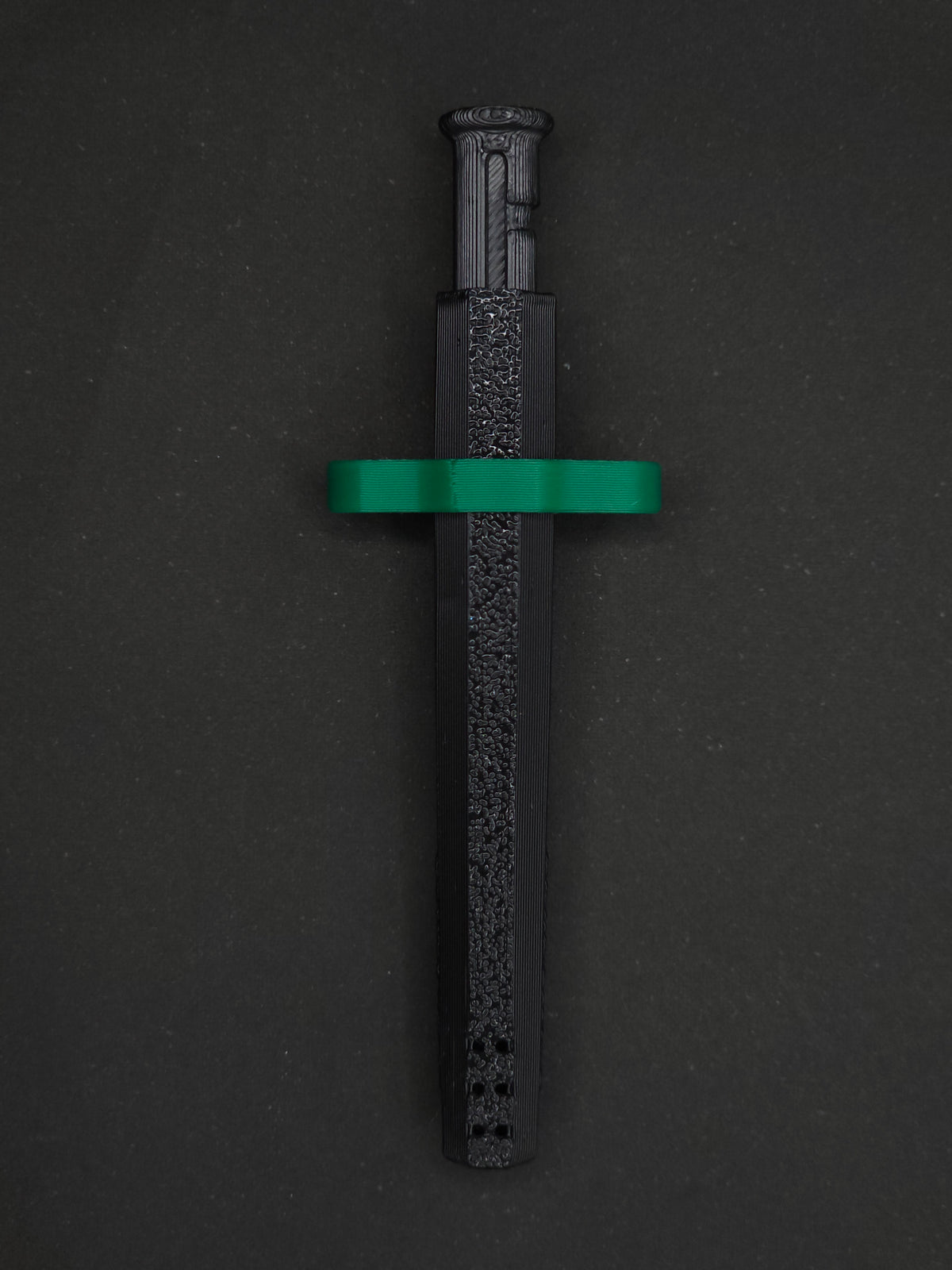 Green necklace adapter on a Black Sniff & Slide spring-loaded bump straw necklace, dark gray background.
