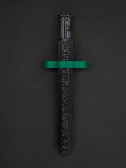 Green necklace adapter on a Black Sniff & Slide spring-loaded bump straw necklace, dark gray background.