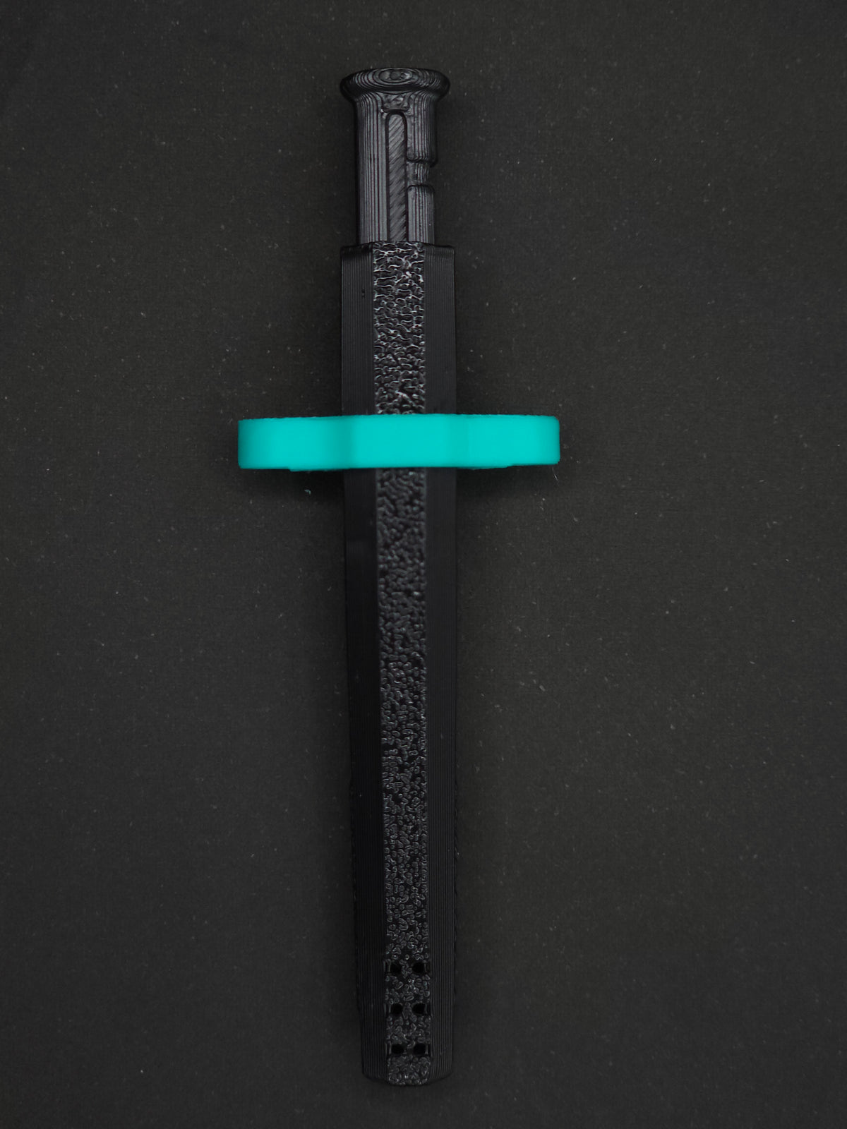 Mint Green necklace adapter on a Black Sniff & Slide spring-loaded bump straw necklace, dark gray background.