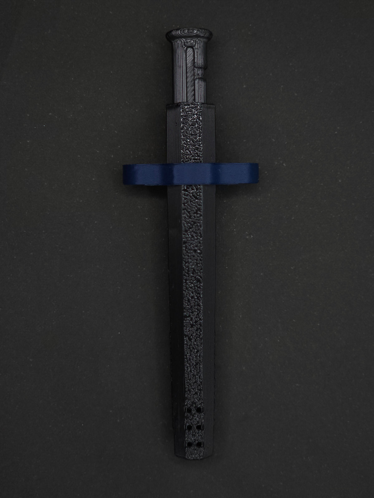 Navy Blue necklace adapter on a Black Sniff & Slide spring-loaded bump straw necklace, dark gray background.