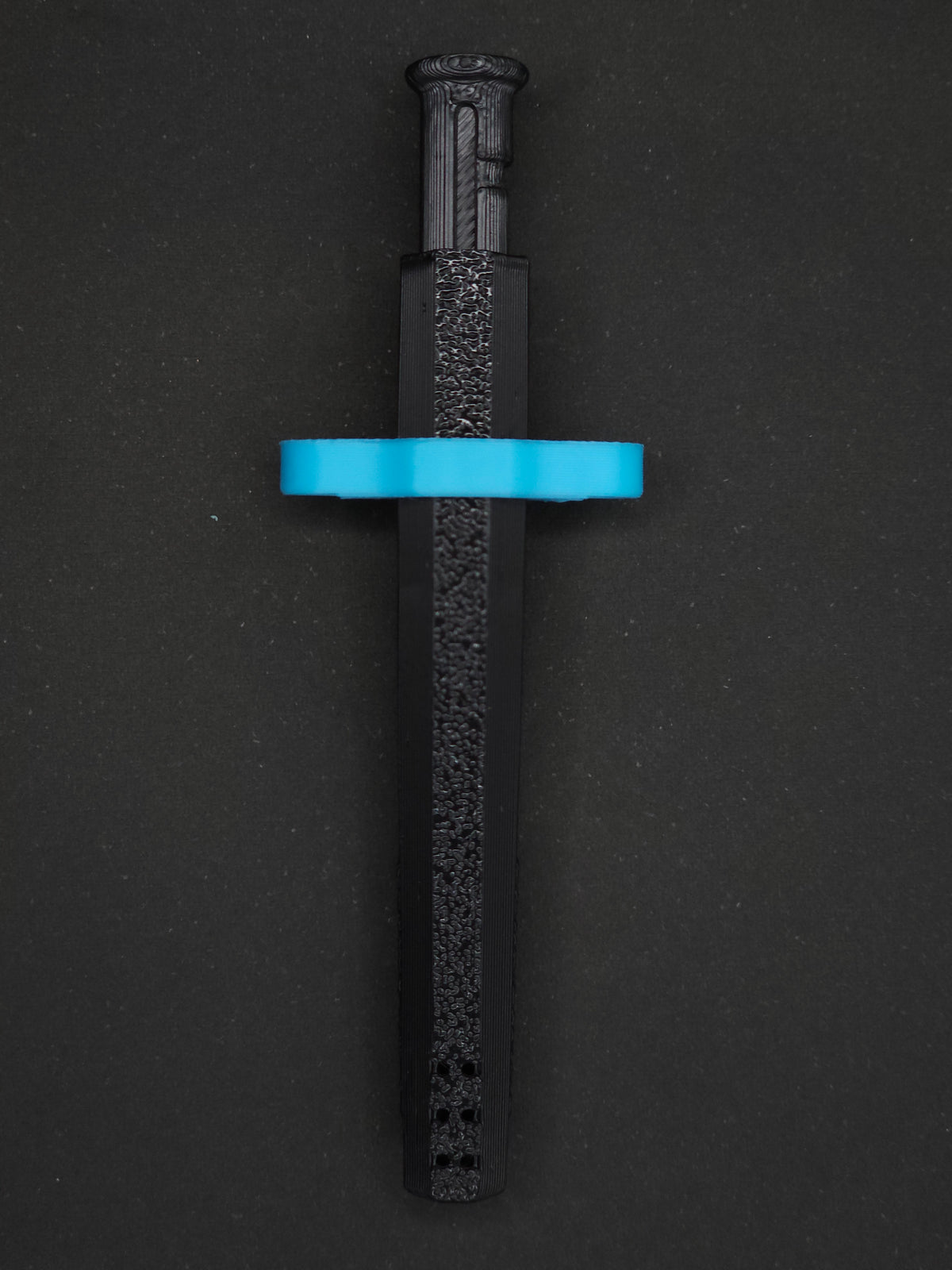 Sky Blue necklace adapter on a Black Sniff & Slide spring-loaded bump straw necklace, dark gray background.