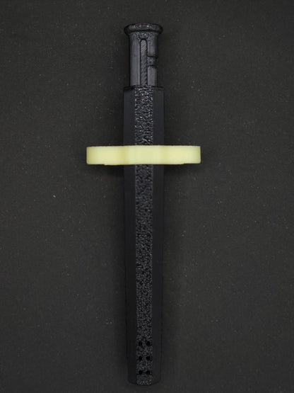 Yellow necklace adapter on a Black Sniff & Slide spring-loaded bump straw necklace, dark gray background.