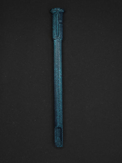 A sparkly dark blue/green textured plastic straw scoop insert accessory, shown vertically on a dark gray background.