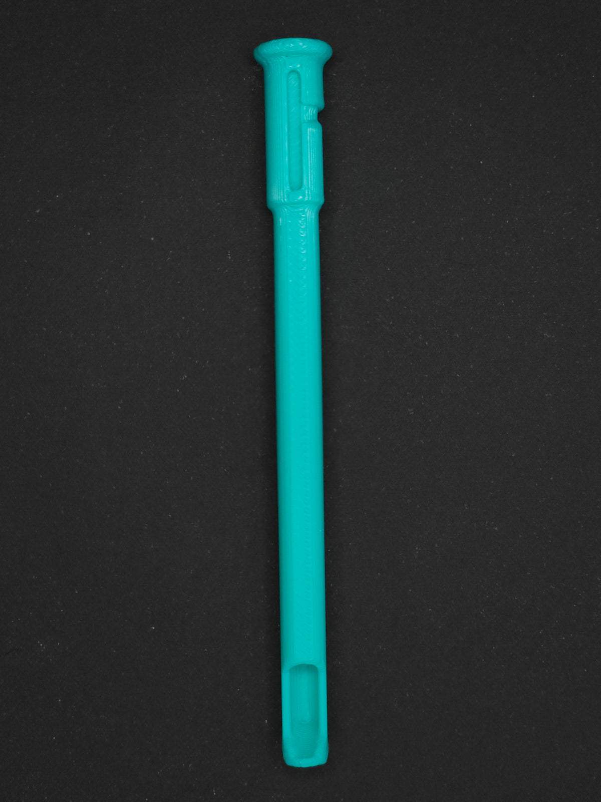 A mint green textured plastic straw scoop insert accessory, shown vertically on a dark gray background.