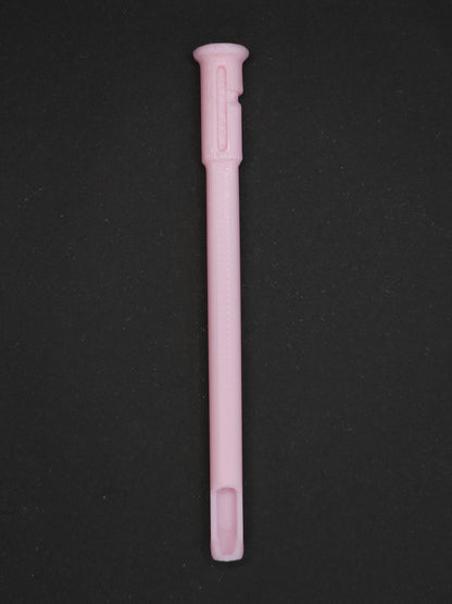 A light pink textured plastic straw scoop insert accessory, shown vertically on a dark gray background.