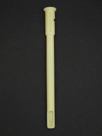 A pale yellow textured plastic straw scoop insert accessory, shown vertically on a dark gray background.
