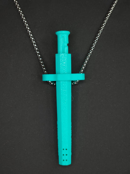 A mint green spring-loaded bump straw pendant on a silver box chain, displayed against a dark textured background