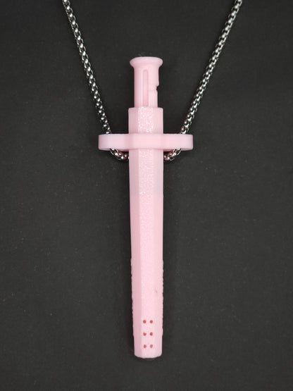 A pink spring-loaded bump straw pendant on a silver box chain, displayed against a dark textured background