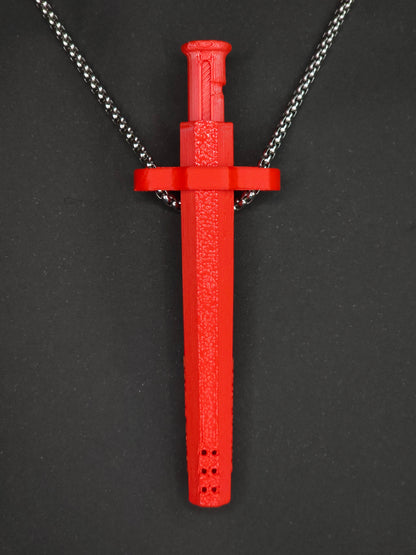 A red spring-loaded bump straw pendant on a silver box chain, displayed against a dark textured background