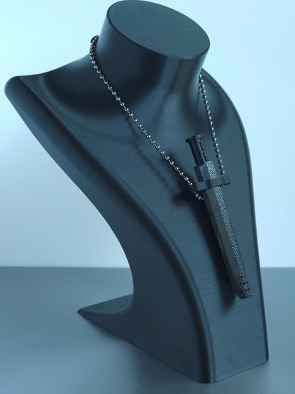 Sniff & Slide spring-loaded bump straw in Onyx Black with silver ball chain, displayed on black mannequin bust, over a white and grey background